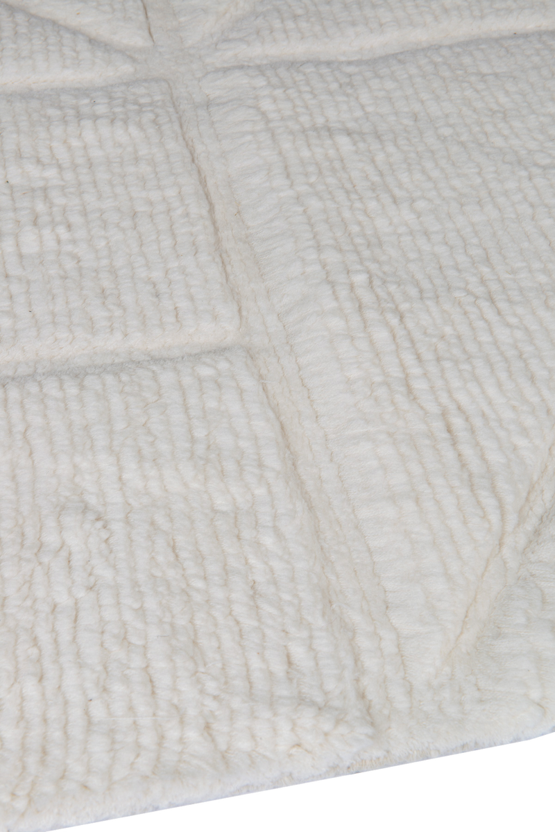 Orryn ivory wool rug edge and textured surface