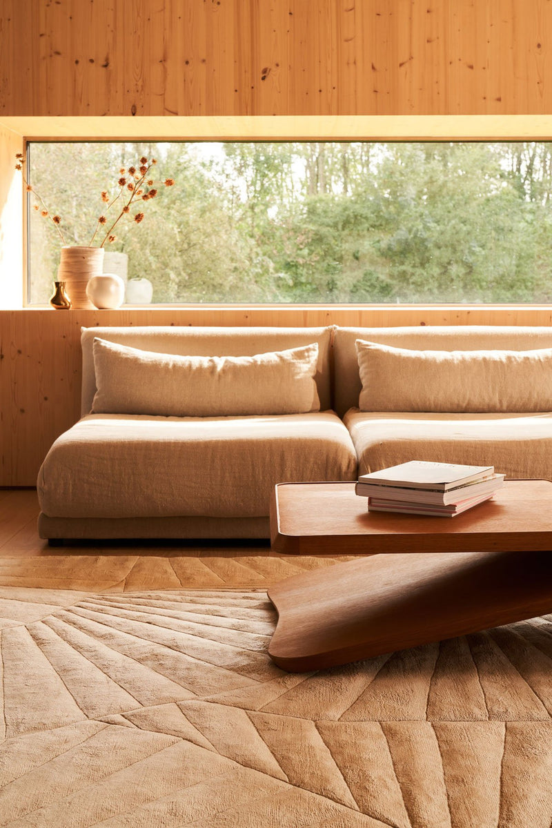 SHELL hand tufted wool rug in a living room