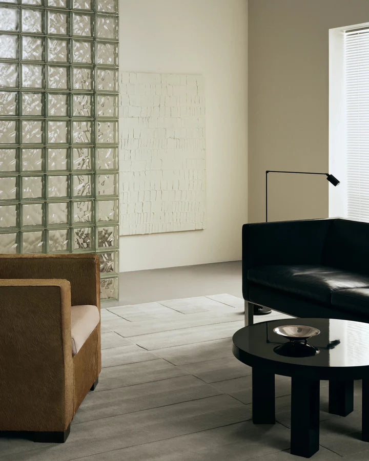 Orriva ivory hand tufted wool rug in a contemporary living room