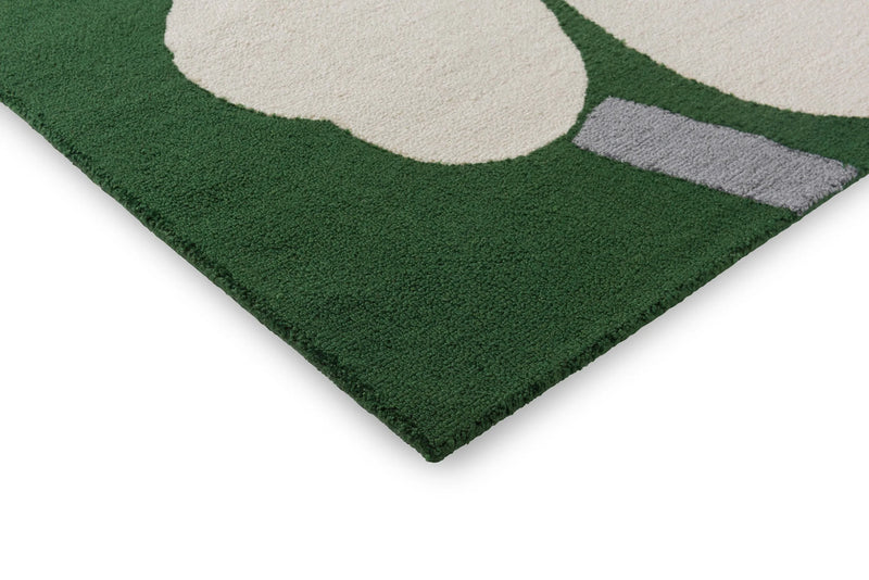 Petalia green wool rug edge and flower detail