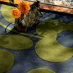 Sanctuary green and grey wool rug in an interior