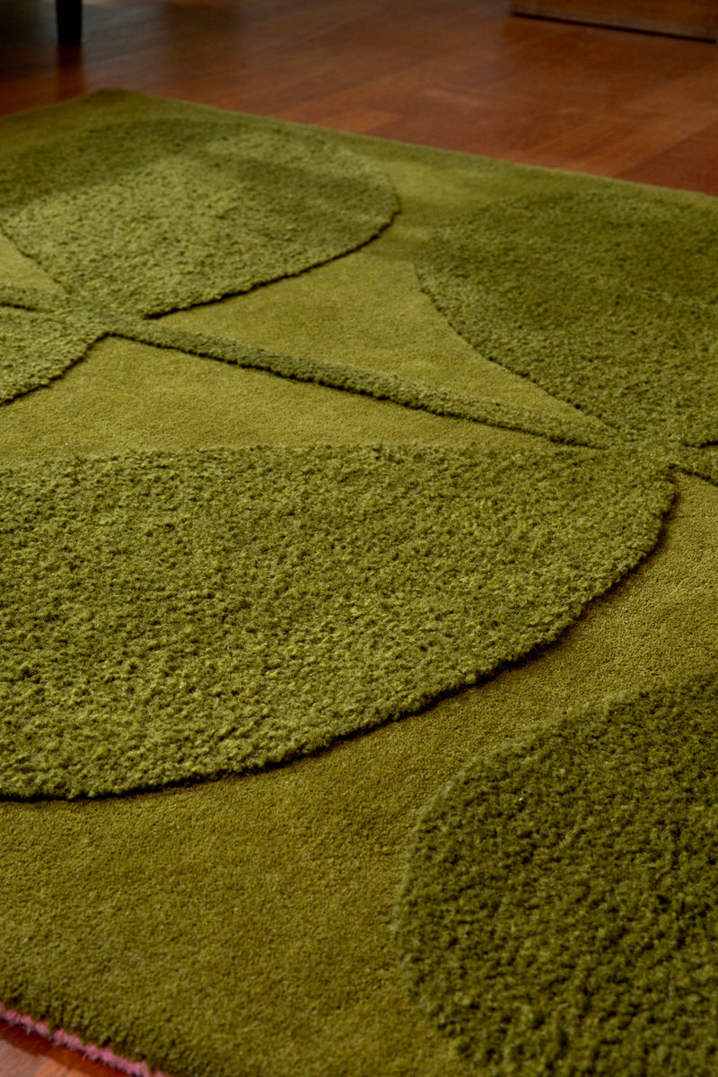 Close-up of Tropical green leaf wool rug texture