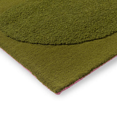 Tropical green wool rug corner detail