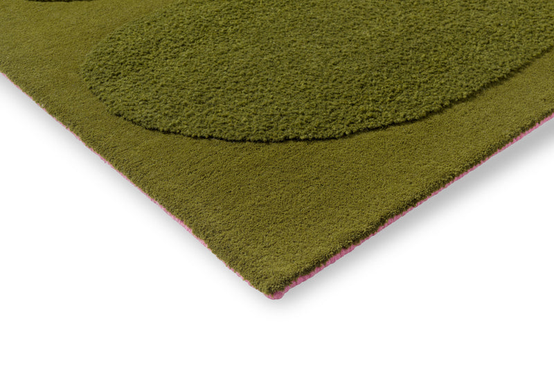 Tropical green wool rug corner detail